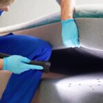 A person cleaning a bed using effective strategies for bed bug treatment, ensuring a pest-free home.